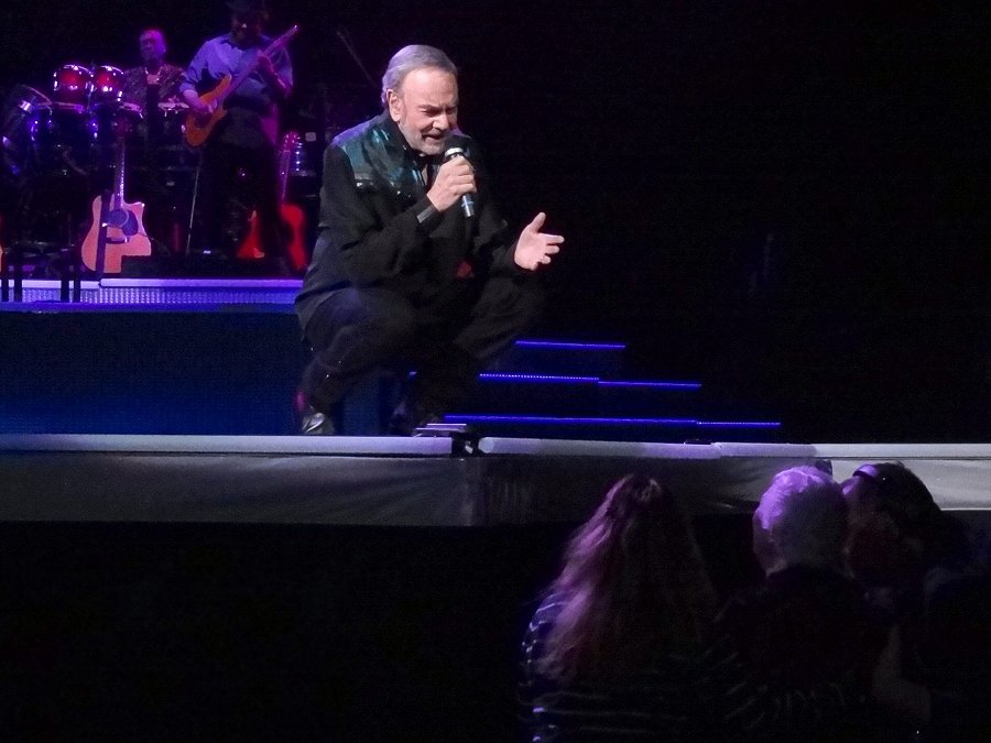 Neil sings to a Senior Mom in the front row!